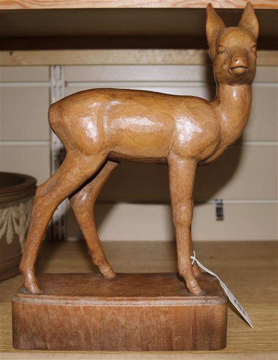 Max Huggler, a carved deer